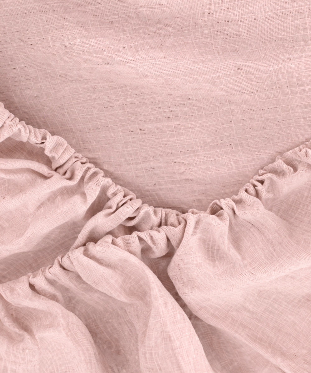 Close-up of a pink linen fitted sheet